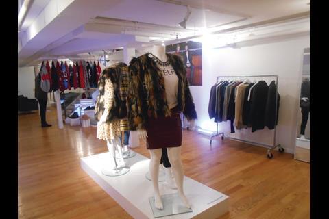 The store is a white box with computer monitors on the ground floor and mannequins wearing the products in the basement.